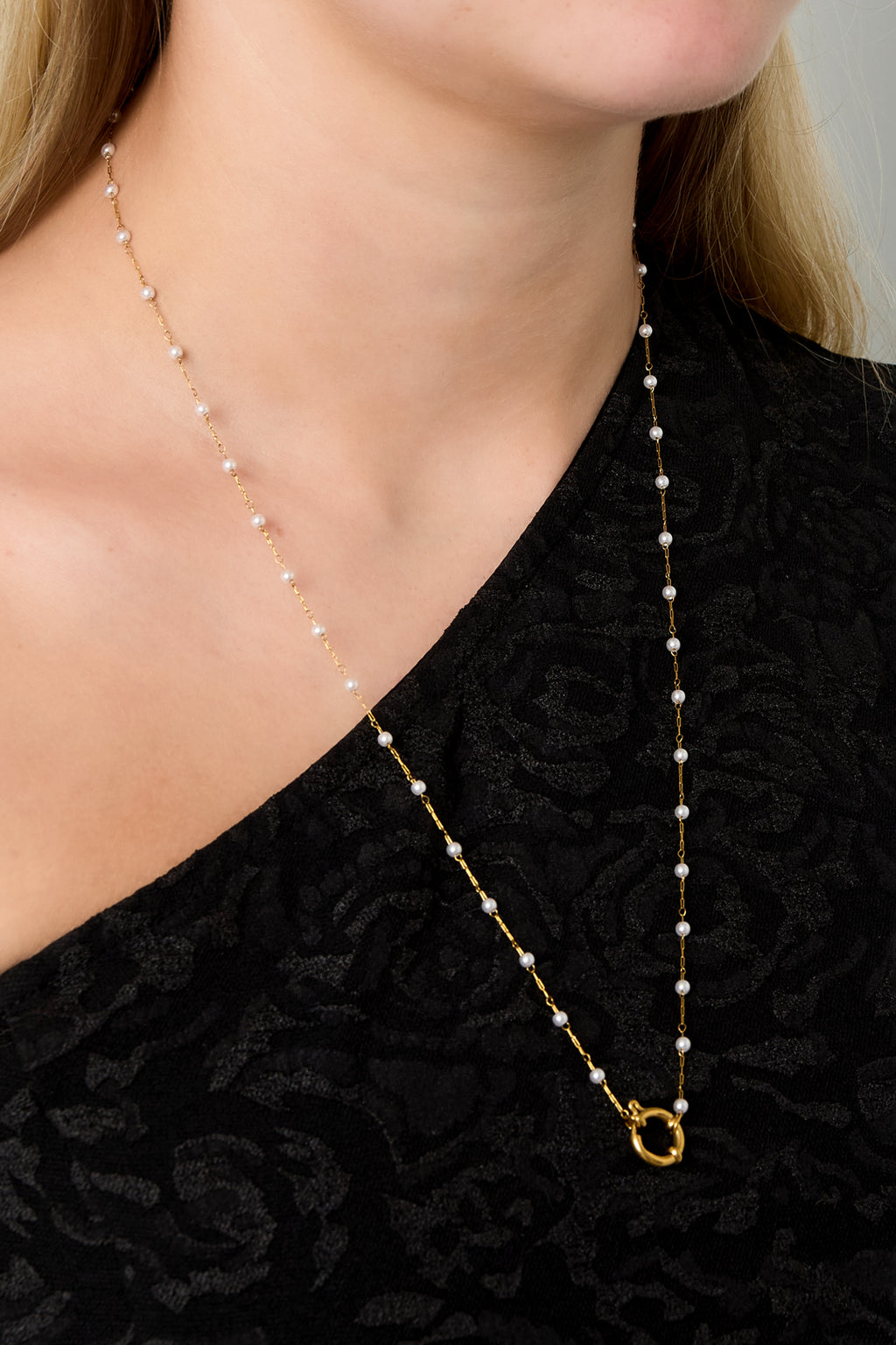 Slot met parelketting